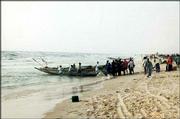 Fishermen pull their pirogues in at Guet N&squot;Dar, the fishermen&squot;s
district in St. Louis, Senegal. Lawrence poet Brian Daldorph spent
five weeks in the West African country in the summer of 2000. The
visit inspired his new poetry collection, "Senegal Blues."