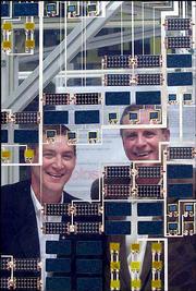 Architects James Timberlake, left, and Stephen Kieran pose for a
portrait behind the Active Panel of the "Solos: SmartWrap" exhibit
at the Cooper-Hewitt, National Design Museum in New York.
Timberlake and Kieran developed SmartWrap, a building skin made of
an ultra-thin polymer-based film with several layers that together
have the capacity to provide shelter, climate control, lighting and
information display, and power.