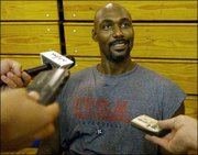 Karl Malone chats with the media after the U.S. Olympic qualifying
basketball team's practice. The squad worked out Tuesday in New
York.