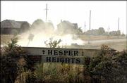 Residents in the Hesper Heights subdivision, at North 1100 and East
2300 roads south of Eudora, are fed up with the amount of dust from
gravel roads in front of their homes. They've asked Douglas County
commissioners to allow them to have the roads paved.