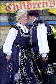 The Duke of York leans in to tell the Duchess a secret at the
Kansas City Renaissance Festival. The annual event begins next
weekend.