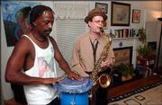 Barry Barnes, left, and Robert Baker, both of Lawrence, rehearse
for Bopaphonic Poetry Circus, a multimedia poetry, music, dance and
sideshow extravaganza slated for Friday and Saturday night at
Lawrence Community Theatre, 1501 N.H. Barnes, Baker and several
other Lawrence performance poets will recite verse with rhythmic
accompaniment, and circus sideshow freaks will entertain between
performances.