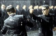 Keanu Reeves, right, punches Hugo Weaving in a scene from the
Warner Bros. Pictures movie "The Matrix Revolutions." The third
film in the "Matrix" series hits theaters this fall.