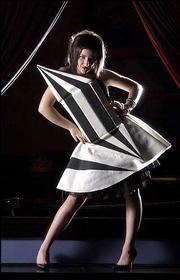 Fashion Designer Taylor Triano models a dress of her own design.
The garment will be part of "Daydream," a fashion performance set
for 8:30 p.m. Sept. 5 at Liberty Hall. Lawrence fashionistas Ashlee
Hall, Sarah Stiefel and Amanda Luginbill of re:form, a fashion show
production company, say the show will offer a sampling of
"underground" fashions.