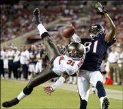Tampa Bay cornerback Tim Wansley (31) breaks up a pass intended for
Houston wide receiver Atnaf Harris. The Buccaneers beat the Texans,
34-3, Thursday in Tampa, Fla.