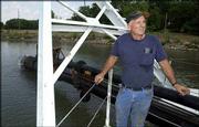 Dave Penny, president and chief executive of Masters Dredging Co.,
is working on Lake Dabanawa in Jefferson County to give waterfront
residents more access. The dredge used for the project uses a bit
that grinds the material at the bottom of the lake and then pumps
it out of the lake.