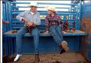 Zach Bradley, 18, of Bonner Springs, left, talks with Skeeter at
the Leavenworth County Fair as they change into riding boots. The
pair were talking about their next ride out of the chute.<br>
<a href="http://www.ljworld.com/art/slideshow/skeeter/3.html"
target="_new" onclick=
"window.open('http://www.ljworld.com/art/slideshow/skeeter/3.html','Photo','height=650,width=750,screenX=10,screenY=10,' + 'scrollbars,resizable'); return false;">
<img src="http://www.ljworld.com/art/icons/icon_photo.gif" border=
"0" alt="video"> Photo Gallery</a><br>