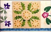 Shirlene and Shirley Wedd's latest creation is a Prairie Flower
quilt. Started in 2001, the quilt is one of the pieces that will be
featured in next weekend's Kaw Valley Quilters Guild Show.