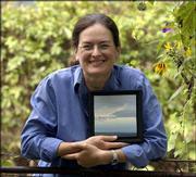 Lawrence artist Lisa Grossman is creating awards for the eighth
annual Phoenix Awards. Each award will be a unique but related
landscape painting.