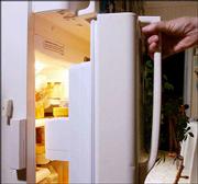 Mary, 74, opens her refrigerator, which has a sensor on the left to
record and relay the opening and closing of the door, in her in
home in Albany, N.Y. General Electric's home assurance system
allows Mary's children to see what their mother is doing by going
to a secure Internet site. The refrigerator is monitored to make
certain that senior citizens are getting food on a regular basis.