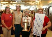 Coldwell Banker McGrew Real Estate employees tout the Pacesetter
Award that they were given during the kickoff celebration of the
United Way of Douglas County 2003-2004 campaign. From left are
Carrie Sinks, Nancy Breithaupt, Mary Jones and Jolene Cole. Peoples
Bank also received a Pacesetter Award during the event Sept. 17 at
the Dole Institute of Politics.