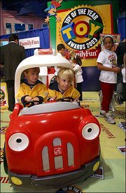Peter, left, and Billy Chabot, of Rye, N.Y., play in the Five Alarm
Fun Center, which was unveiled Thursday as the FamilyFun Magazine
Toy of the Year at Toys 'R Us Times Square in New York. The 22
winners of the annual T.O.Y. Awards were selected after 30,000
hours of play testing by more than 900 children of the 479 toys
submitted by 148 manufacturers.