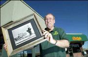 Duane Buck, owner of Bucky's Drive-In, has put the 42-year-old
business up for sale. Buck took over the business in 1966 when it
was Sandy's Drive-In, as seen in photograph. It became Bucky's in
1975.