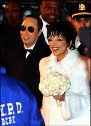 David Gest and Liza Minnelli leave Marble Collegiate Church in New
York after their wedding in this file photo from March 16, 2002.
Gest sued Minnelli for $10 million Tuesday, accusing his estranged
wife of alcohol-fueled violence that caused neurological damage and
headaches.
