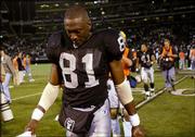 Oakland's Tim Brown walks off the field after the Raiders' 17-10
loss to Kansas City. The loss Monday night in Oakland dropped the
Raiders five games behind the Chiefs in the AFC West.