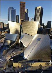 Early morning sun illuminates the new Walt Disney Concert Hall in
downtown Los Angeles. The hall, designed by Frank Gehry, opens
today.