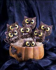 A pumpkin makes a container for a clutch of edible monsters for
youngsters to wolf down. Preparing the cookies can be a family
project.