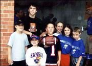 The Carmody cousins show their Jayhawk spirit at the first Kansas
University football game of the 2003 season on Aug. 30. Tyler
Carmody, 17, stands in back. The others, from left, are Jeff
Carmody, 12; Ellie Carmody, 6; Brian Carmody, 10; Margie Carmody,
12; Nikki Carmody, 8; and Matt Carmody, 7. Tyler and Jeff are the
sons of Tom and Kay Carmody; Nikki and Matt are the children of
John and Wendy Carmody, all of Lawrence; and Ellie, Brian and
Margie are the children of Mike and Dee Dee Carmody, Omaha, Neb.
Grandparents Tom and Grace Carmody, Lawrence, submitted the
picture.