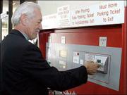 Dewey Reynolds attempts to feed money into the airport parking
garage's "express pay station," at the airport in Richmond, Va.
After several unsuccessful attempts, he had to go to a clerk. "It
comes with the territory," the 64-year-old Richmond real estate
broker says of the sporadic technological glitches he has
encountered as air travel becomes increasingly automated.