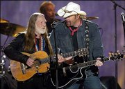 Willie Nelson, left, joins Toby Keith as they sing "Beer for My
Horses" during the 38th annual Academy of Country Music Awards on
May 21 in Las Vegas. The nominees for the Country Music Assn.
Awards -- to be held Wednesday -- reflect a shift from pop-leaning
crossover females to the more male-dominated traditional country.
Keith leads all performers with seven nominations, and country
legend Nelson has several nominations.