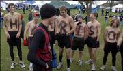 The Lawrence High cross country squad spells "Harrison" on their
chests in honor of Harry Swartz, the lone boys' state qualifier for
the Lions. Swartz placed 59th at the Class 6A state meet Saturday
at Rim Rock Farm.