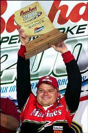 Bobby Hamilton celebrates his victory in the Bashas' Supermarket
200. Hamilton won the event Saturday at Phoenix International
Raceway in Avondale, Ariz.