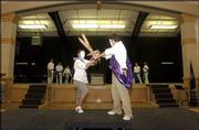 Bishop Seabury Academy sophomores Grayson Dillon, left, and Adam
Davis act out a sword fight as fellow "Antigone" cast members look
on. The cast rehearsed the Greek tragedy Monday in Seabury's new
theater in preparation for performances this Friday and Saturday.