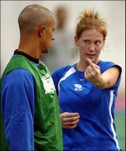 Kansas University freshman Nikki Alvarez, right, chats with Jayhawk
soccer coach Mark Francis during practice. The Jayhawks worked out
Tuesday at Anschutz Pavilion in preparation for Friday's match with
UCLA in the NCAA Tournament.