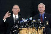 Santa Barbara County Dist. Atty. Tom Sneddon, left, and Sheriff Jim
Anderson speak at a news conference in Santa Barbara, Calif.,
regarding multiple charges of sexual molestation against singer
Michael Jackson. Authorities issued an arrest warrant for Jackson
Wednesday.