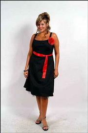 Whether they are a size 3 or 16, girls want to be trendy cookie
cutters of each other, says Patricia VanCleave, president of
Torrid, the sister store to hip retailer Hot Topic. Pictured is an
example of some of the plus-size clothing being offered for
children.