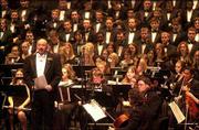 Conductor John Paul Johnson addresses the audience during last
year's 78th annual Holliday Vespers at the Lied Center. This year's
concerts are set for Saturday and Dec. 7.