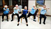 Kansas University dance professor Janet Hamburg, center, leads,
from left, Linda Tuttle, Les Beguelin, Linda Davis and Garry
Wheeler through "Motivating Moves," her seated exercise program for
people with Parkinson&squot;s disease. The video, which was produced by
the Parkinson&squot;s Disease Foundation, will be available Feb. 6.