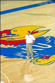 Kansas basketball coach Bill Self watches players work out during
the preseason. Self replaced coach Roy Williams in April. KU's
athletic department experienced a major overhaul in 2003 after AD
Al Bohl was fired and replaced by Lew Perkins.