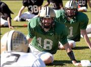 Purdue quarterback Kyle Orton laughs while stretching during
practice. The Boilermakers worked out Saturday in Orlando, Fla., in
preparation for their New Year's Day date with Georgia in the
Capital One Bowl.