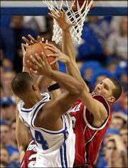 Louisville's Francisco Garcia, right, blocks a shot by Kentucky's
Chuck Hayes. Louisville defeated Kentucky, 65-56, Saturday in
Lexington, Ky.