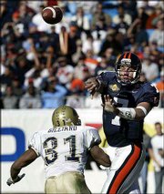 Virginia's Matt Schaub (7) throws a pass over Pittsburgh's Tyrone
Gilliard (31). Schaub was the MVP of the Continental Tire Bowl
Saturday at Charlotte, N.C.