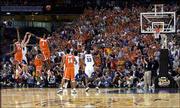 Kirk Hinrich launches a three-point attempt in the closing seconds
of the championship game of the NCAA Tournament. The shot, which
would have tied the game, failed and Syracuse defeated KU 81-78 for
the national title.