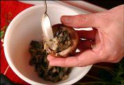 Stuffing a mushroom cap is part of the process of turning the
useful fungus into a tasty hors d'oeuvre. There are many variations
of stuffings that produce rich, warm and pleasant offerings for
guests.