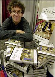 French sociologist Loic Wacquant poses with copies of his book,
"Body & Soul: Notebooks of an Apprentice Boxer," at the
American Anthropological Assn.'s centennial convention in Chicago.
Wacquant, a professor at the University of California, Berkeley,
doubled as an amateur prizefighter while completing his doctoral
degree at the University of Chicago in the late '80s and early
'90s.
