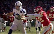 Indianapolis wide receiver Brandon Stokley (83) crosses the goal
line while being chased by Kansas City cornerback Dexter McCleon
(22). The Colts' offense rolled in a 38-31 victory Sunday at
Arrowhead Stadium in Kansas City, Mo., and Indy advanced to the AFC
championship Sunday at New England.