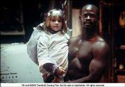 Emma Bolger, left, and Djimon Hounsou star in Jim Sheridan&squot;s tale
of Irish immigrants adjusting to New York, "In America."