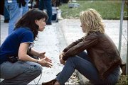 Filmmaker Patty Jenkins, left, a Lawrence native, directs star
Charlize Theron on the set of "Monster." The drama tells the story
of executed murderer Aileen Wuornos, who is regarded as "America&squot;s
first female serial killer." The film is expected to earn Theron an
Academy Award nomination for Best Actress.