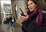 Deborah Bleau, 44, of Latham, N.Y., uses a walkie talkie to
communicate with her daughter in Boston. An annual Massachusetts
Institute of Technology survey found that many adults said they
couldn't live without their pesky cell phones.