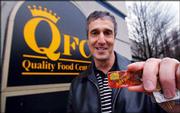 Brian Weinstein, 49, displays his preferred customer discount card
in front of a QFC grocery story in Mercer Island, Wash. During the
recent beef recall related to a Washington case of mad cow disease,
the regional grocery chain used its discount cards to advise
concerned shoppers whether they might have purchased meat from the
infected cow. QFC posted a small notice in its meat departments
letting cardholders know they could find out whether they'd bought
any of the beef recalled by the U.S. Department of Agriculture.
Weinstein bought recalled beef and served it to his family.