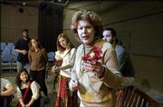 Kansas University voice professor Joyce Castle, who's directing and
starring in KU Opera's upcoming production of "Strawberry Fields,"
rehearses with the student cast. Castle played "The Old Lady" to
critical acclaim in the 1999 premiere of the show at Glimmerglass
Opera in New York.