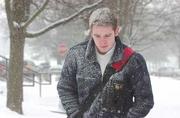 Alan Kilday, 20, a Kansas University junior from Scotland, felt
just like home Thursday morning as the snow covered his coat and
head while he walked to classes.