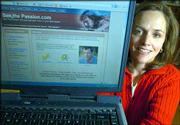 Jennifer Giroux, Cincinnati, Ohio, displays a computer with her Web
site promoting "The Passion of the Christ," on the screen. The Web
site is part of a massive marketing campaign among churches and
Christians to promote the Mel Gibson film, which depicts the final
days of Jesus&squot; life.