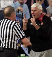 Texas Tech coach Bob Knight, right, pleads his case for a
one-and-one free-throw opportunity for the Red Raiders.