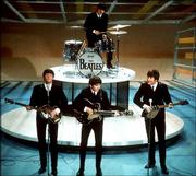 The Beatles perform on CBS' "The Ed Sullivan Show" Feb. 9, 1964, in
New York. From left, front, are Paul McCartney, George Harrison and
John Lennon. Ringo Starr plays drums.