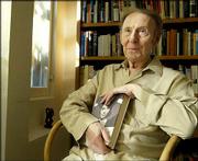 Author Gavin Lambert holds a copy of his book, "Natalie Wood, A
Life." Robert Wagner, Wood&squot;s former husband, gave Lambert full
cooperation for the book.